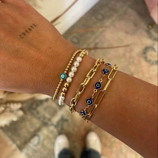 Evil Eye armbåndsett i 18K gullbelagt design med justerbar kjede
